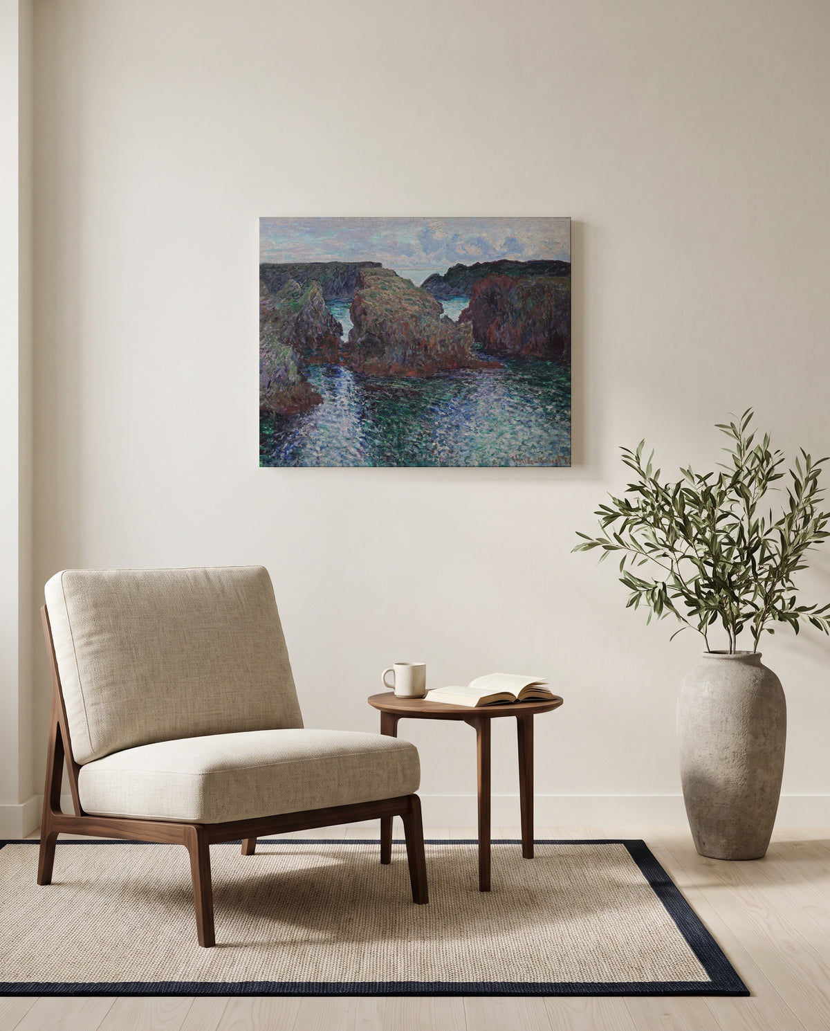 Rocks at Port-Goulphar, Belle-Île by Claude Monet as a stretched canvas above a linen lounge chair in a reading corner