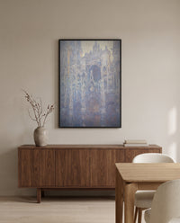 Rouen Cathedral, Morning by Claude Monet in a black frame above a walnut sideboard in a dining room