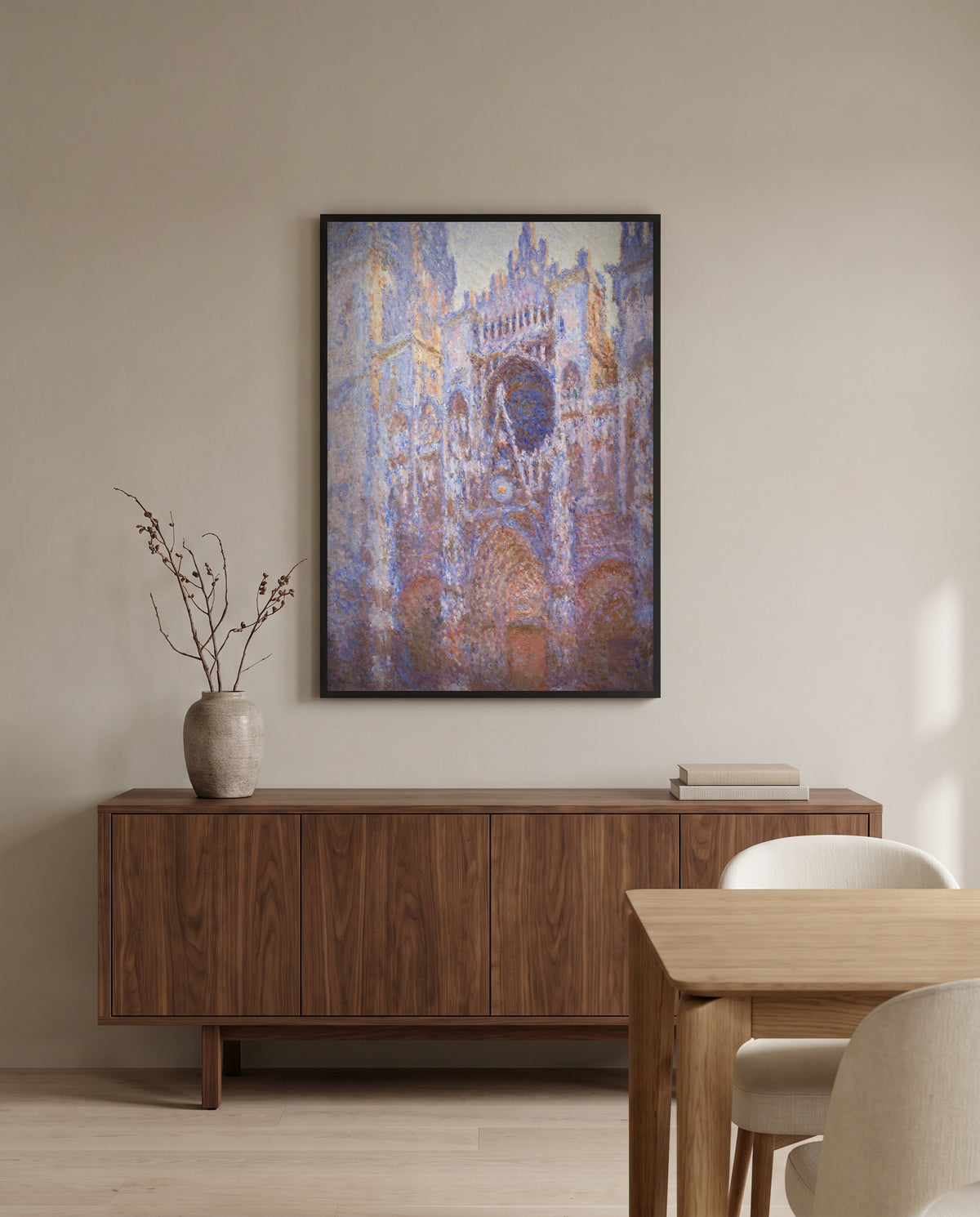 Rouen Cathedral, Façade by Claude Monet in a black frame above a walnut sideboard in a dining room