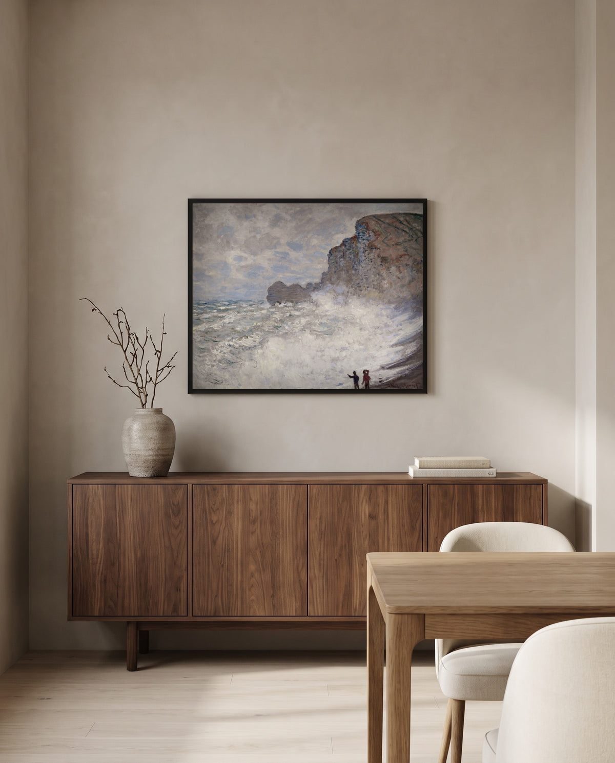 Rough Weather at Étretat by Claude Monet in a black frame above a walnut sideboard in a dining room