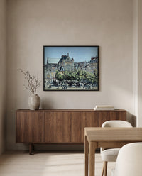 Saint-Germain-l’Auxerrois by Claude Monet in a black frame above a walnut sideboard in a dining room