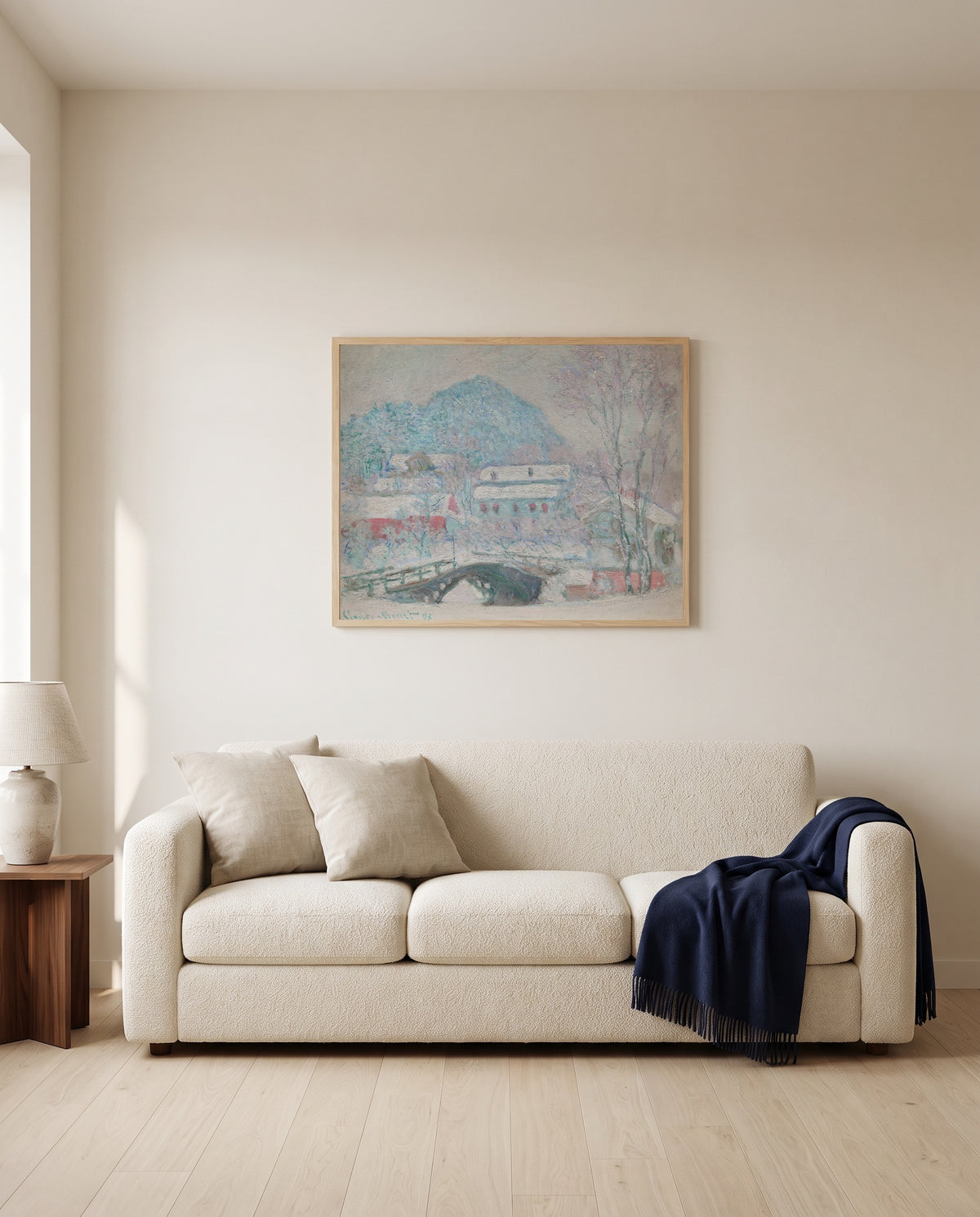 Sandvika, Norway by Claude Monet framed in natural oak above a cream sofa in a warm living room