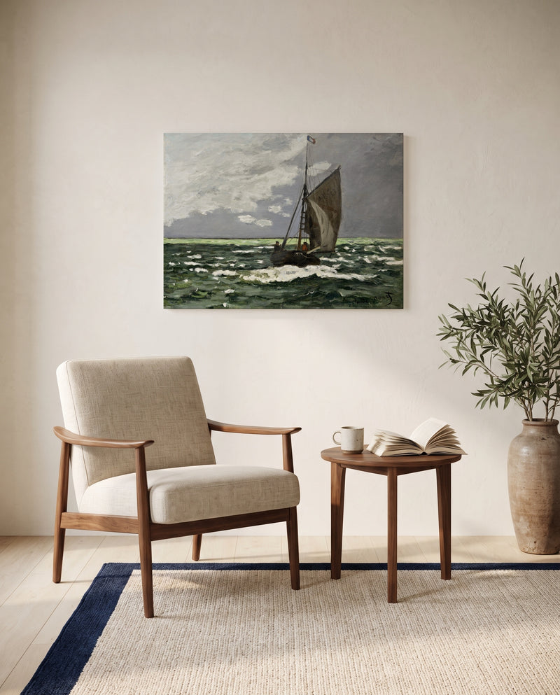 Seascape, Storm by Claude Monet as a stretched canvas above a linen lounge chair in a reading corner