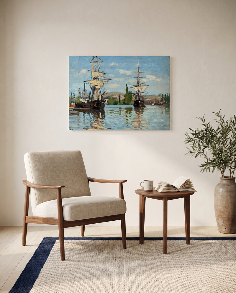 Ships Riding on the Seine at Rouen by Claude Monet as a stretched canvas above a linen lounge chair in a reading corner