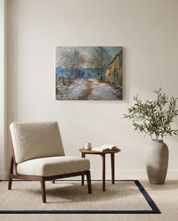 Snow Effect at Limetz by Claude Monet as a stretched canvas above a linen lounge chair in a reading corner