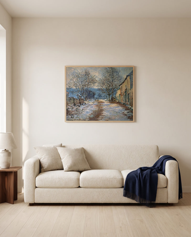 Snow Effect at Limetz by Claude Monet framed in natural oak above a cream sofa in a warm living room