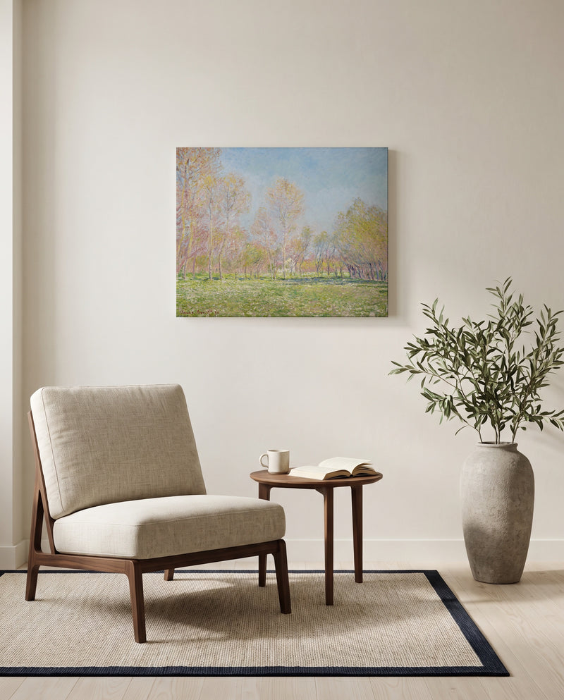 Spring in Giverny by Claude Monet as a stretched canvas above a linen lounge chair in a reading corner