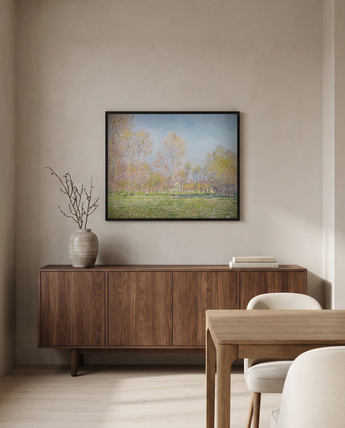Spring in Giverny by Claude Monet in a black frame above a walnut sideboard in a dining room