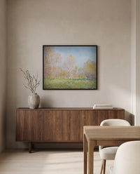 Spring in Giverny by Claude Monet in a black frame above a walnut sideboard in a dining room