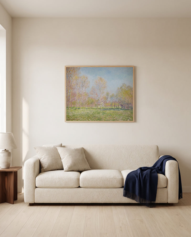 Spring in Giverny by Claude Monet framed in natural oak above a cream sofa in a warm living room