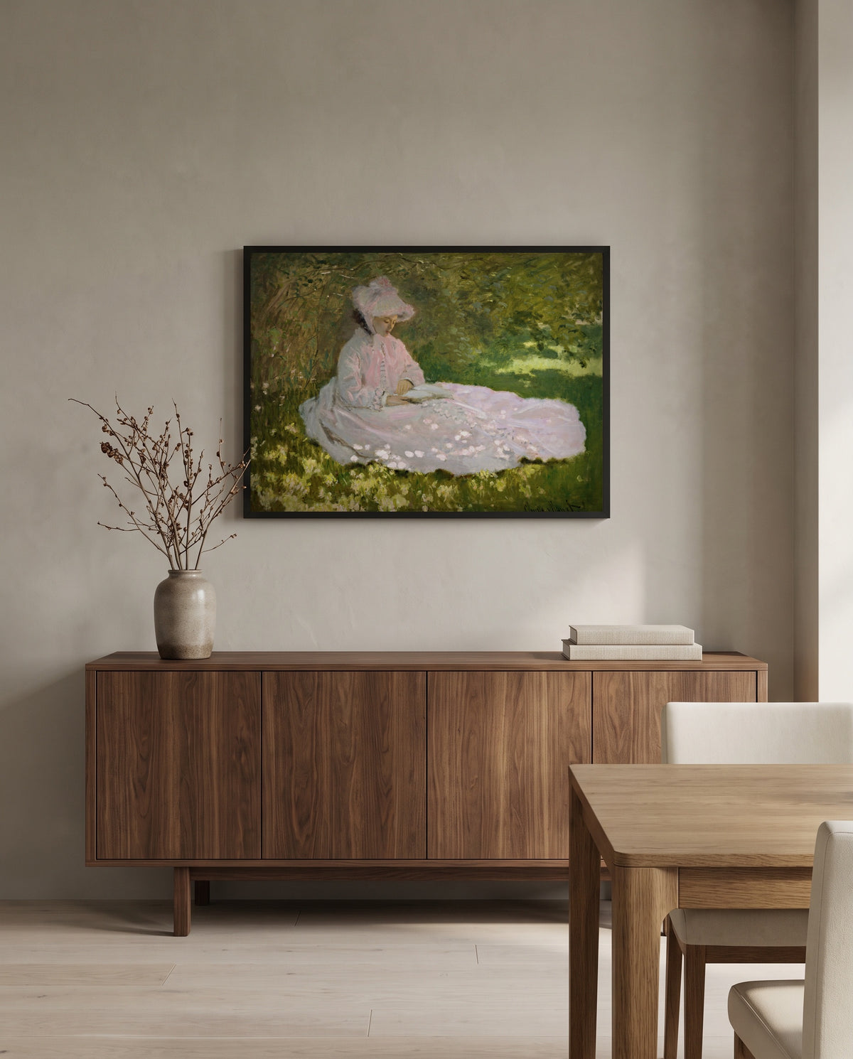 Springtime by Claude Monet in a black frame above a walnut sideboard in a dining room