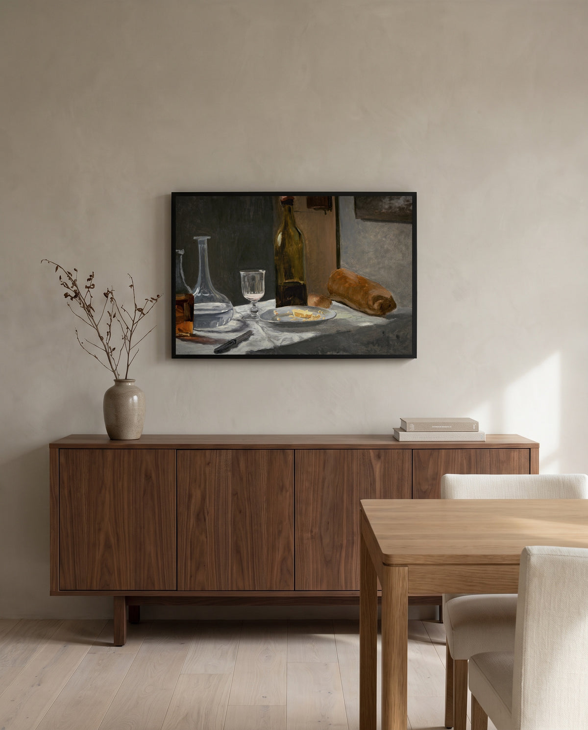 Bread and Wine by Claude Monet in a black frame above a walnut sideboard in a dining room