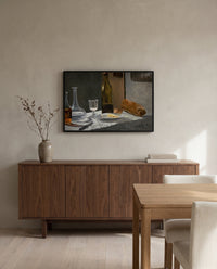 Bread and Wine by Claude Monet in a black frame above a walnut sideboard in a dining room