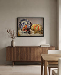 Still Life with Melon by Claude Monet in a black frame above a walnut sideboard in a dining room