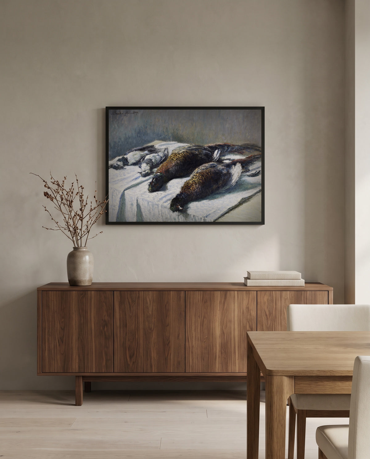 Pheasants and Plovers by Claude Monet in a black frame above a walnut sideboard in a dining room