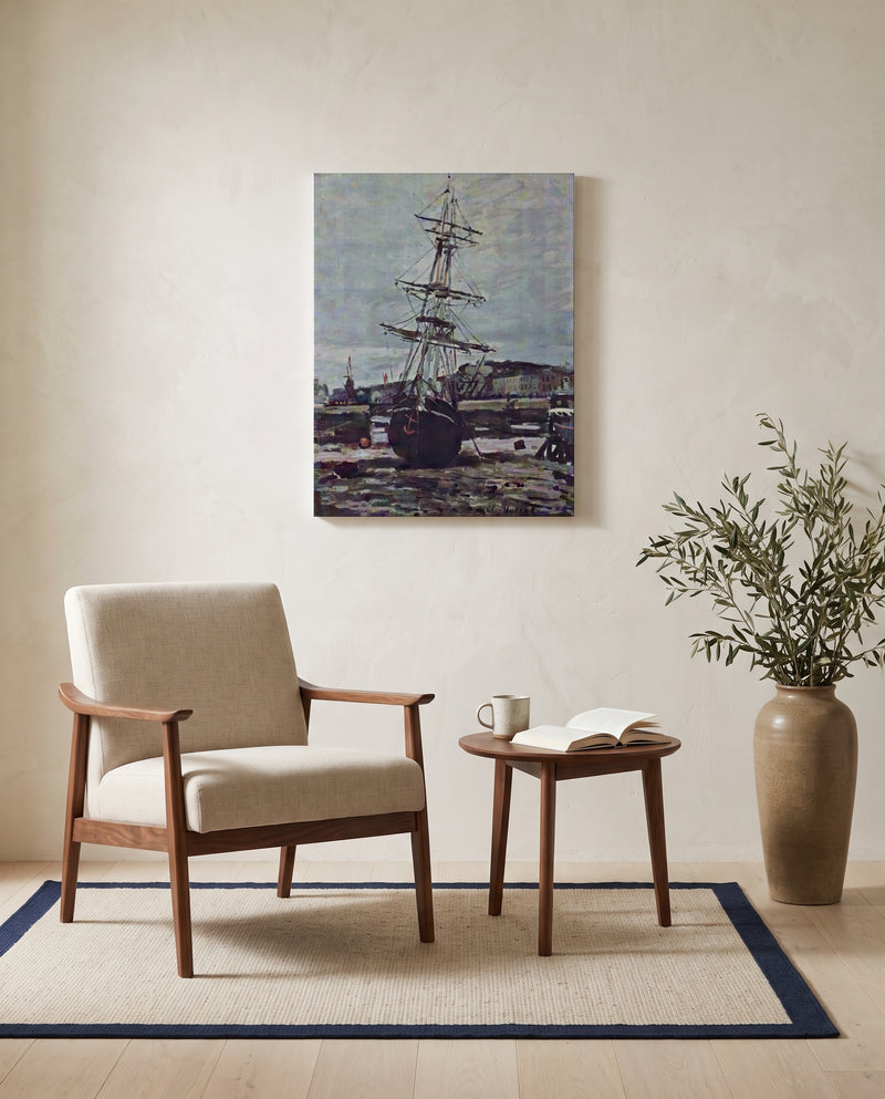 Stranded Boat at Fécamp by Claude Monet as a stretched canvas above a linen lounge chair in a reading corner