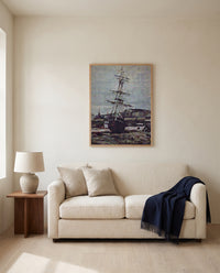 Stranded Boat at Fécamp by Claude Monet framed in natural oak above a cream sofa in a warm living room