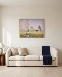 Summer, Meadow at Bezons by Claude Monet framed in natural oak above a cream sofa in a warm living room