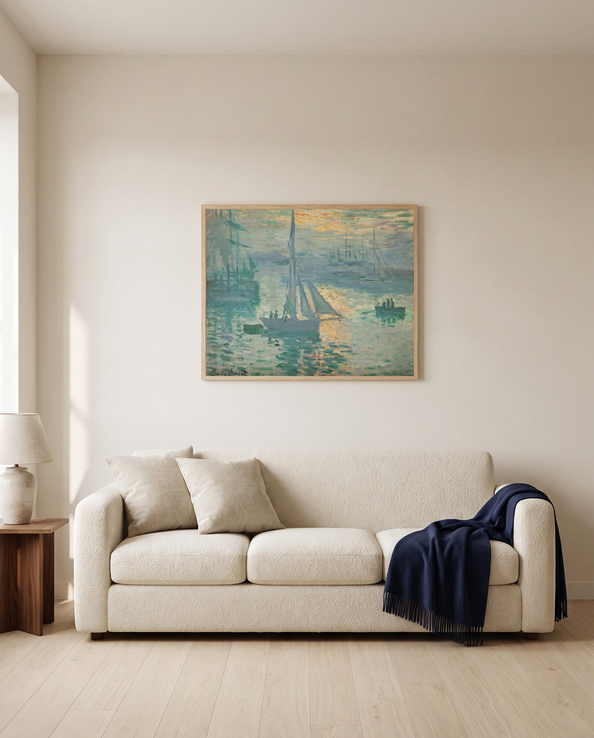 Sunrise (Marine) by Claude Monet framed in natural oak above a cream sofa in a warm living room