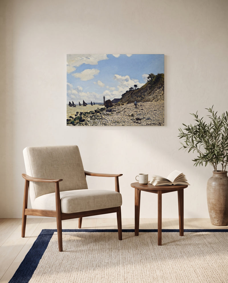 The Beach at Honfleur by Claude Monet as a stretched canvas above a linen lounge chair in a reading corner