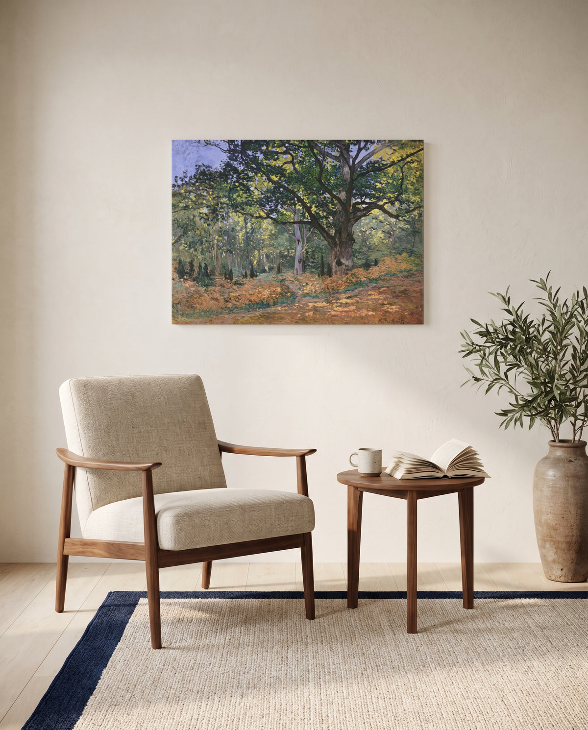 The Bodmer Oak by Claude Monet as a stretched canvas above a linen lounge chair in a reading corner