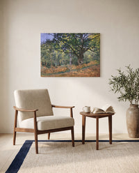 The Bodmer Oak by Claude Monet as a stretched canvas above a linen lounge chair in a reading corner