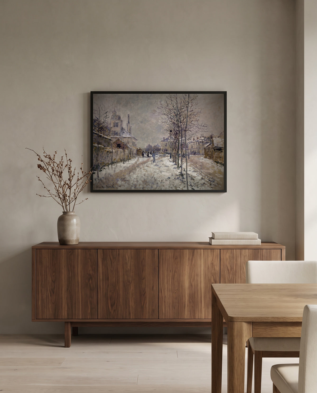 Boulevard de Pontoise, Snow by Claude Monet in a black frame above a walnut sideboard in a dining room
