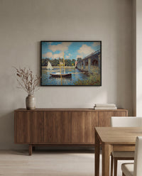 The Bridge at Argenteuil by Claude Monet in a black frame above a walnut sideboard in a dining room