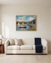The Bridge at Argenteuil by Claude Monet framed in natural oak above a cream sofa in a warm living room