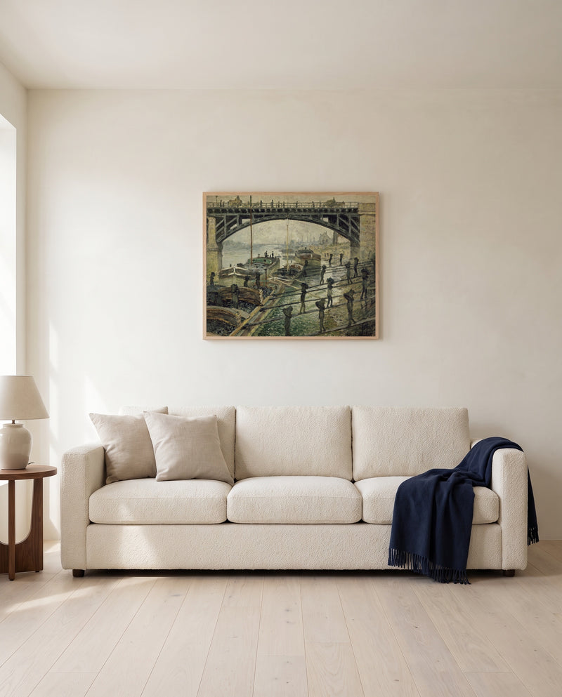 The Coalmen by Claude Monet framed in natural oak above a cream sofa in a warm living room