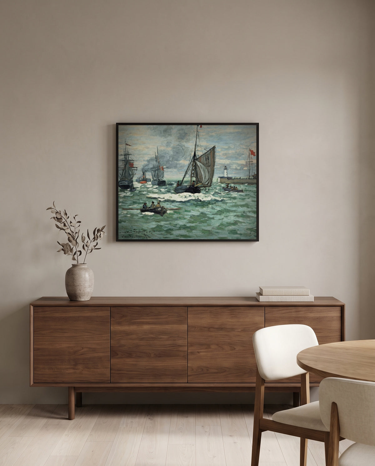 Port of Le Havre Entrance by Claude Monet in a black frame above a walnut sideboard in a dining room