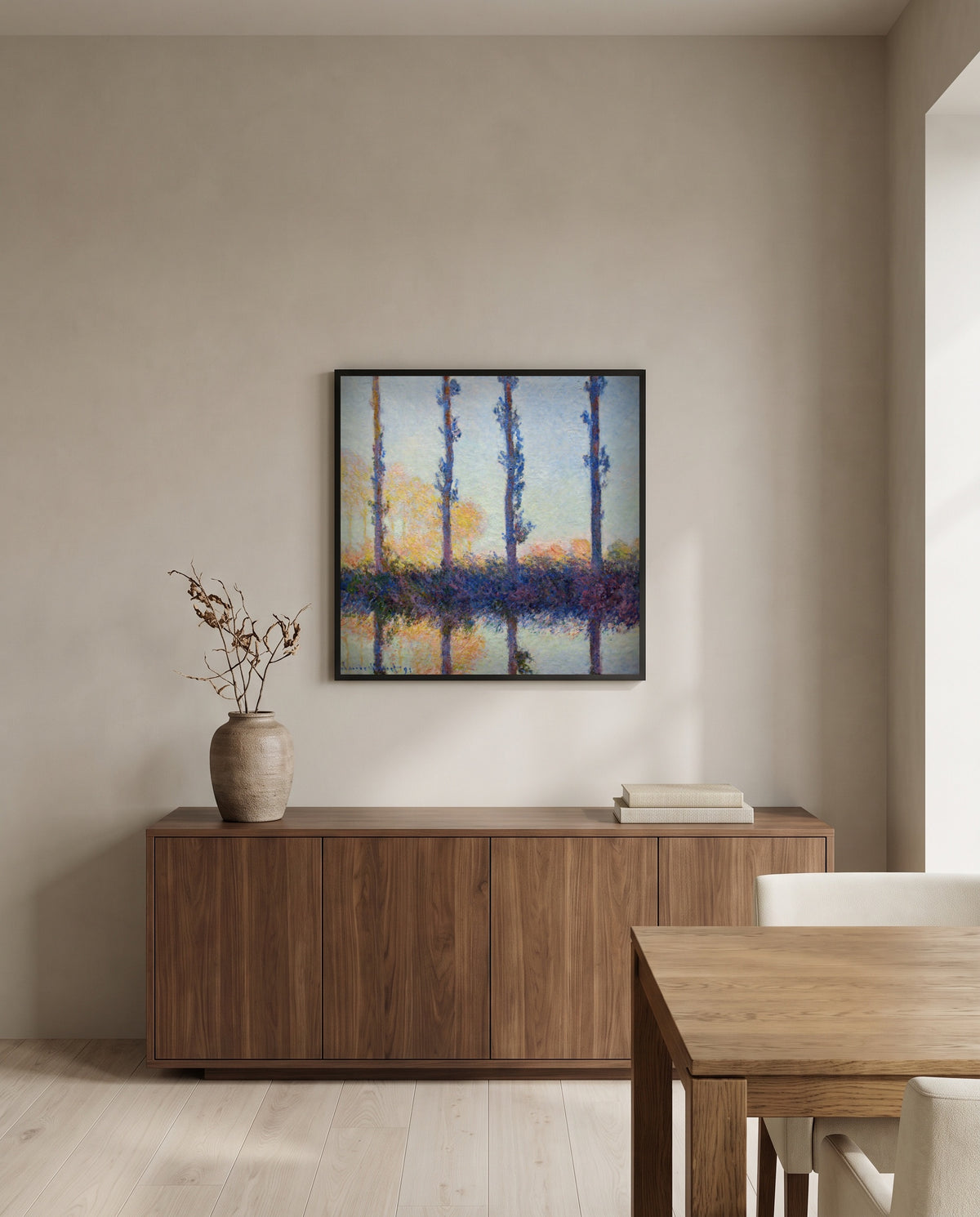The Four Trees by Claude Monet in a black frame above a walnut sideboard in a dining room