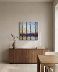The Four Trees by Claude Monet in a black frame above a walnut sideboard in a dining room