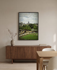 Garden of the Princess by Claude Monet in a black frame above a walnut sideboard in a dining room