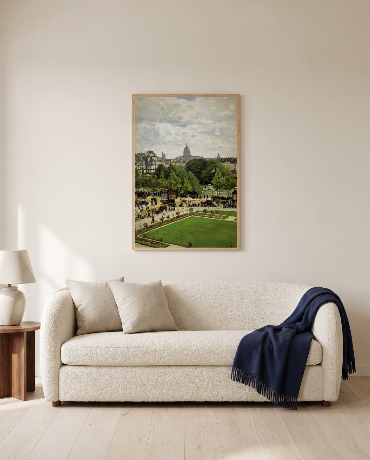 Garden of the Princess by Claude Monet framed in natural oak above a cream sofa in a warm living room