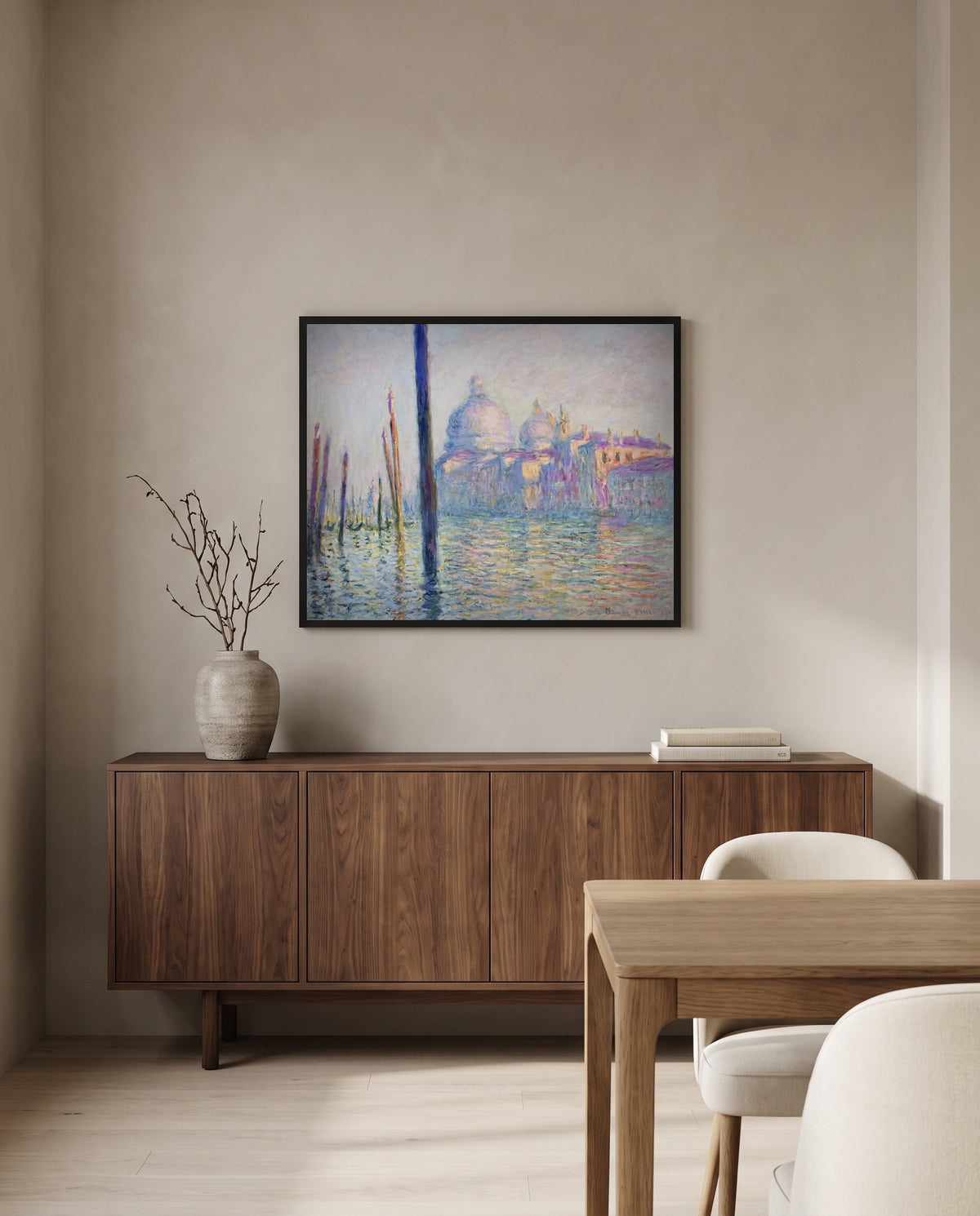 The Grand Canal, Venice by Claude Monet in a black frame above a walnut sideboard in a dining room