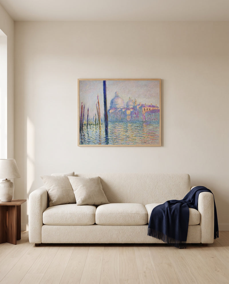 The Grand Canal, Venice by Claude Monet framed in natural oak above a cream sofa in a warm living room