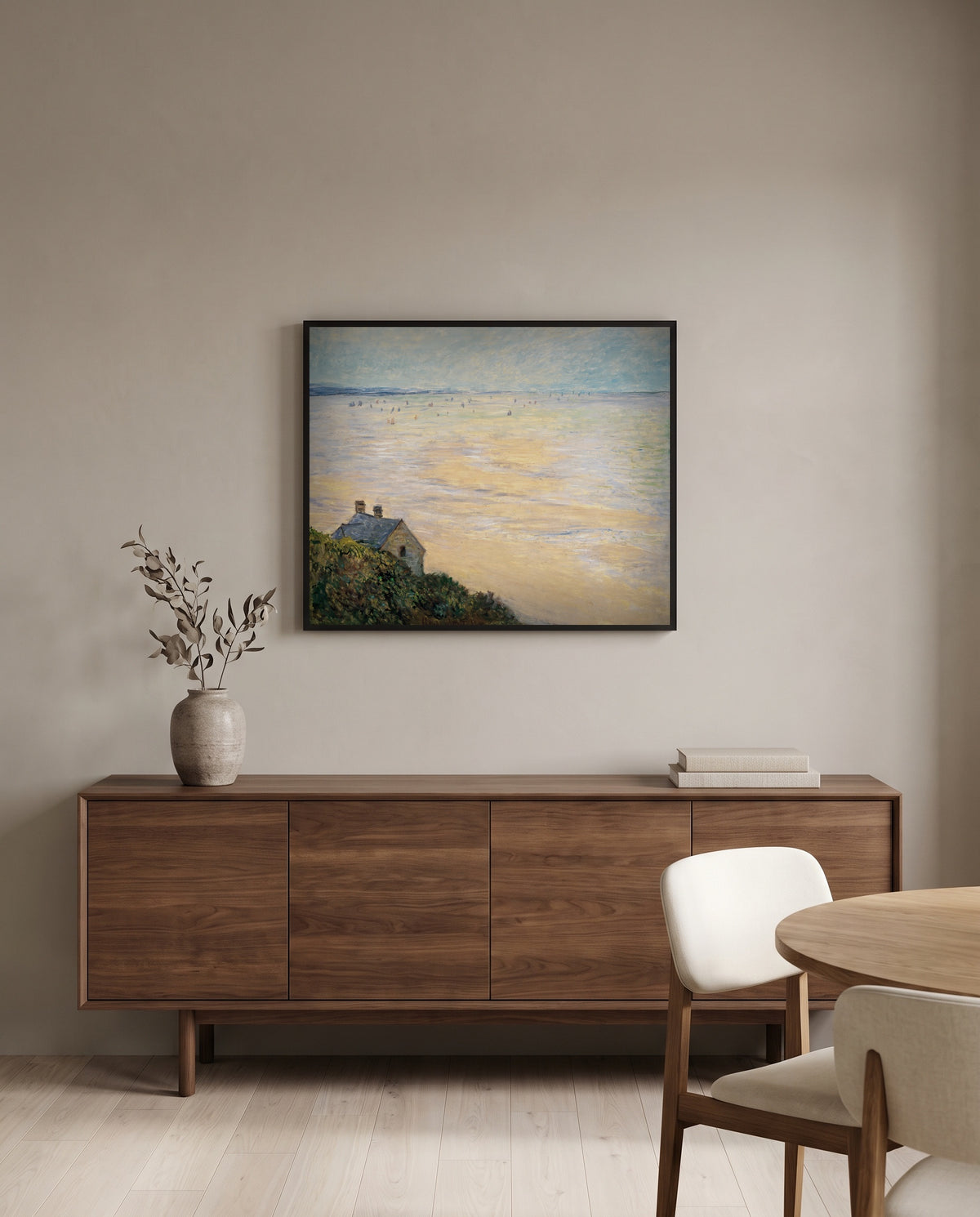 Hut at Trouville by Claude Monet in a black frame above a walnut sideboard in a dining room