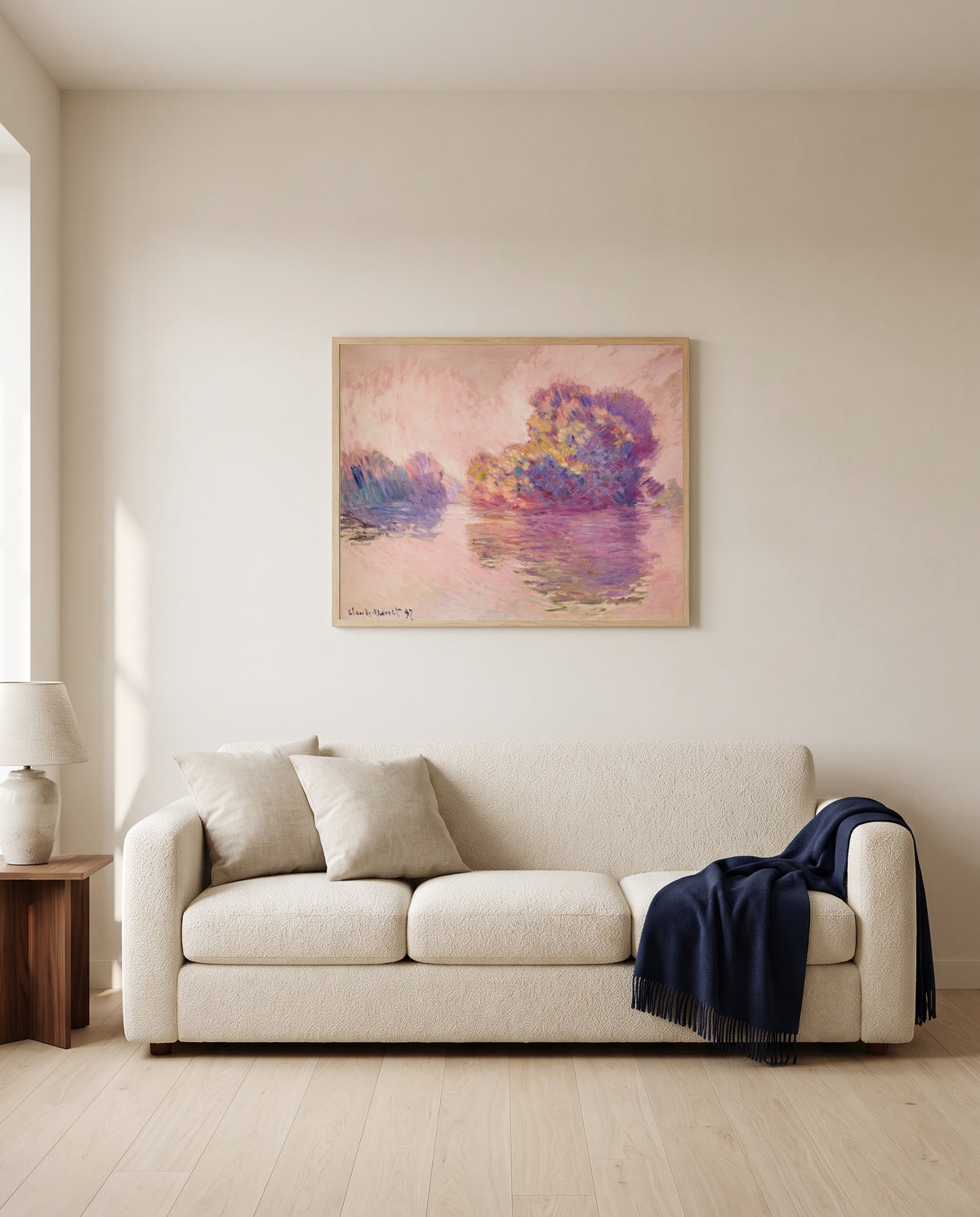 Islets at Port-Villez by Claude Monet framed in natural oak above a cream sofa in a warm living room