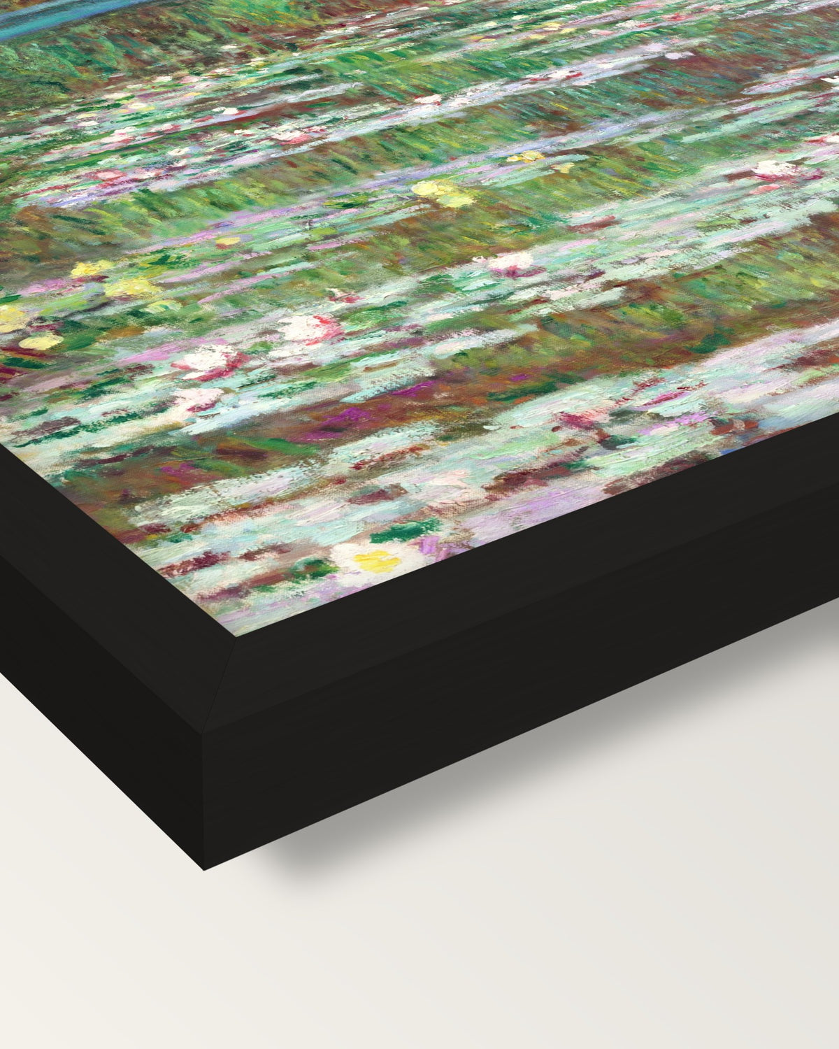 The Japanese Footbridge by Monet framed print, corner close-up: black moulding, mitred, the print set just below its edge