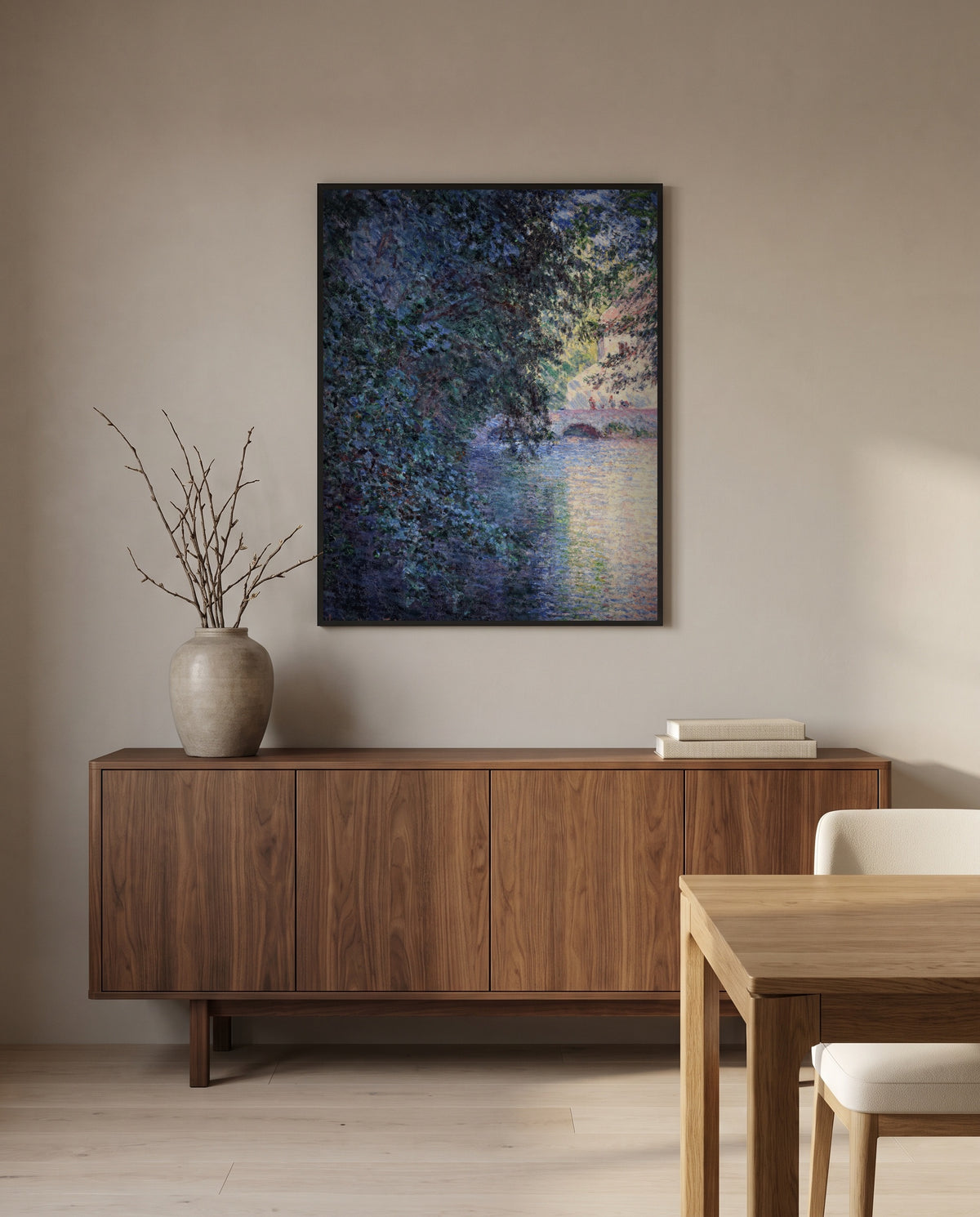 The Mill at Limetz by Claude Monet in a black frame above a walnut sideboard in a dining room