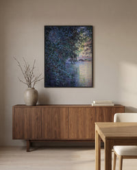 The Mill at Limetz by Claude Monet in a black frame above a walnut sideboard in a dining room