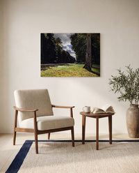 The Pavé de Chailly by Claude Monet as a stretched canvas above a linen lounge chair in a reading corner