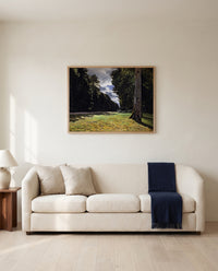 The Pavé de Chailly by Claude Monet framed in natural oak above a cream sofa in a warm living room