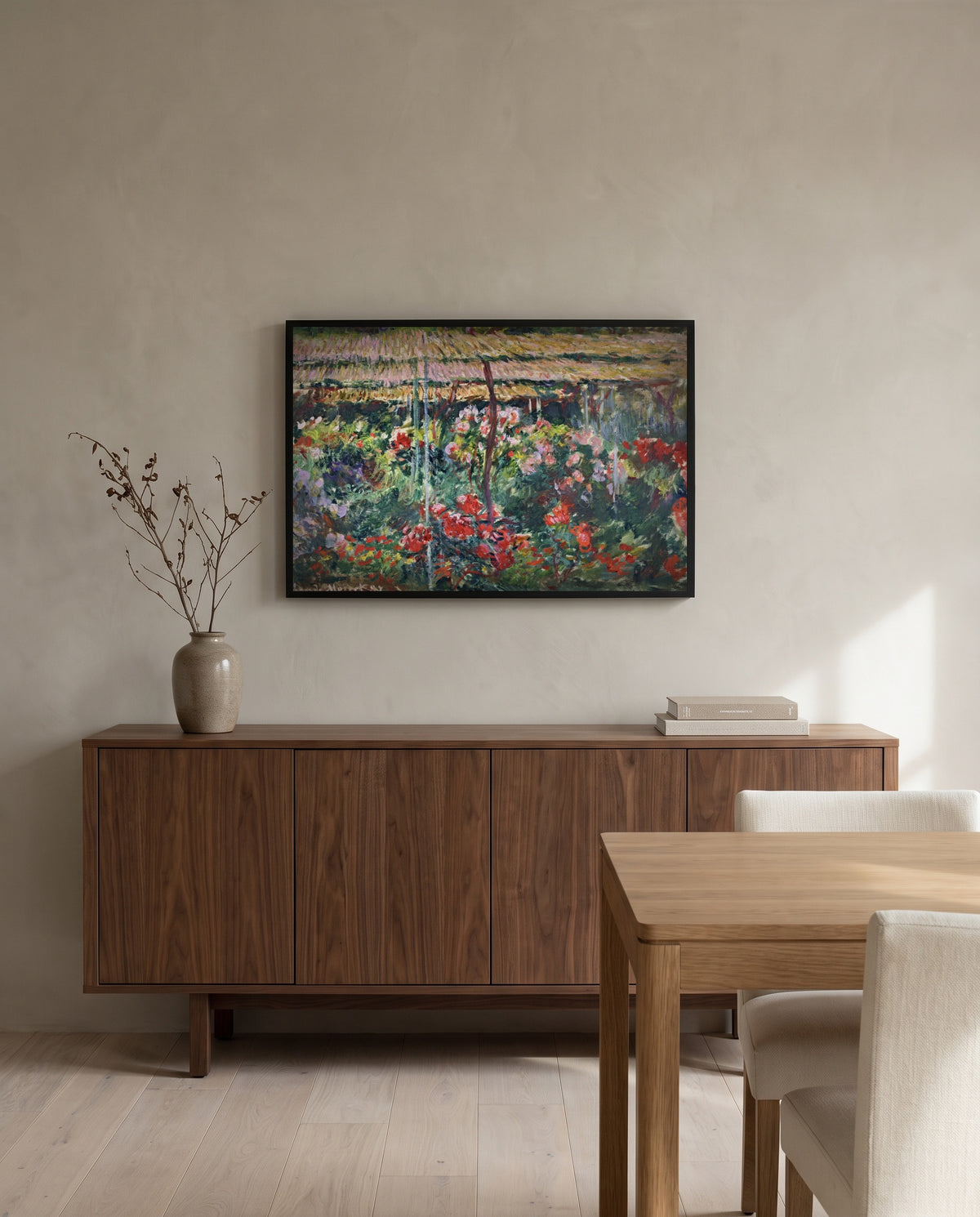 The Peony Garden by Claude Monet in a black frame above a walnut sideboard in a dining room