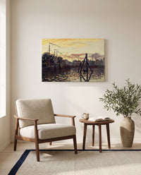 The Port of Zaandam by Claude Monet as a stretched canvas above a linen lounge chair in a reading corner