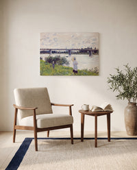 Promenade, Railroad Bridge by Claude Monet as a stretched canvas above a linen lounge chair in a reading corner