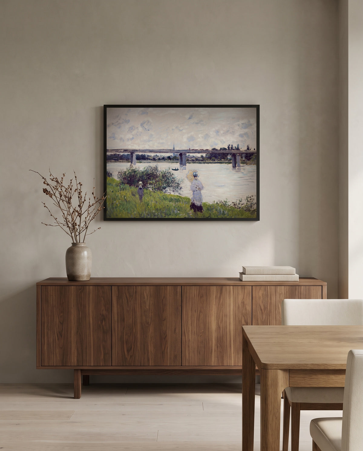 Promenade, Railroad Bridge by Claude Monet in a black frame above a walnut sideboard in a dining room
