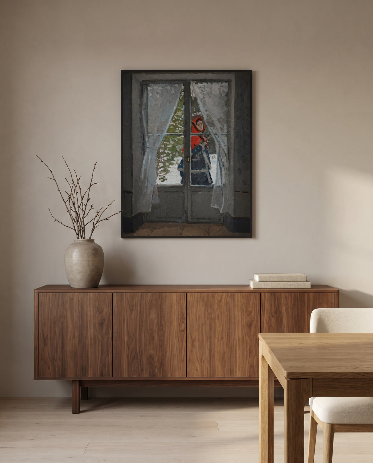 The Red Kerchief by Claude Monet in a black frame above a walnut sideboard in a dining room