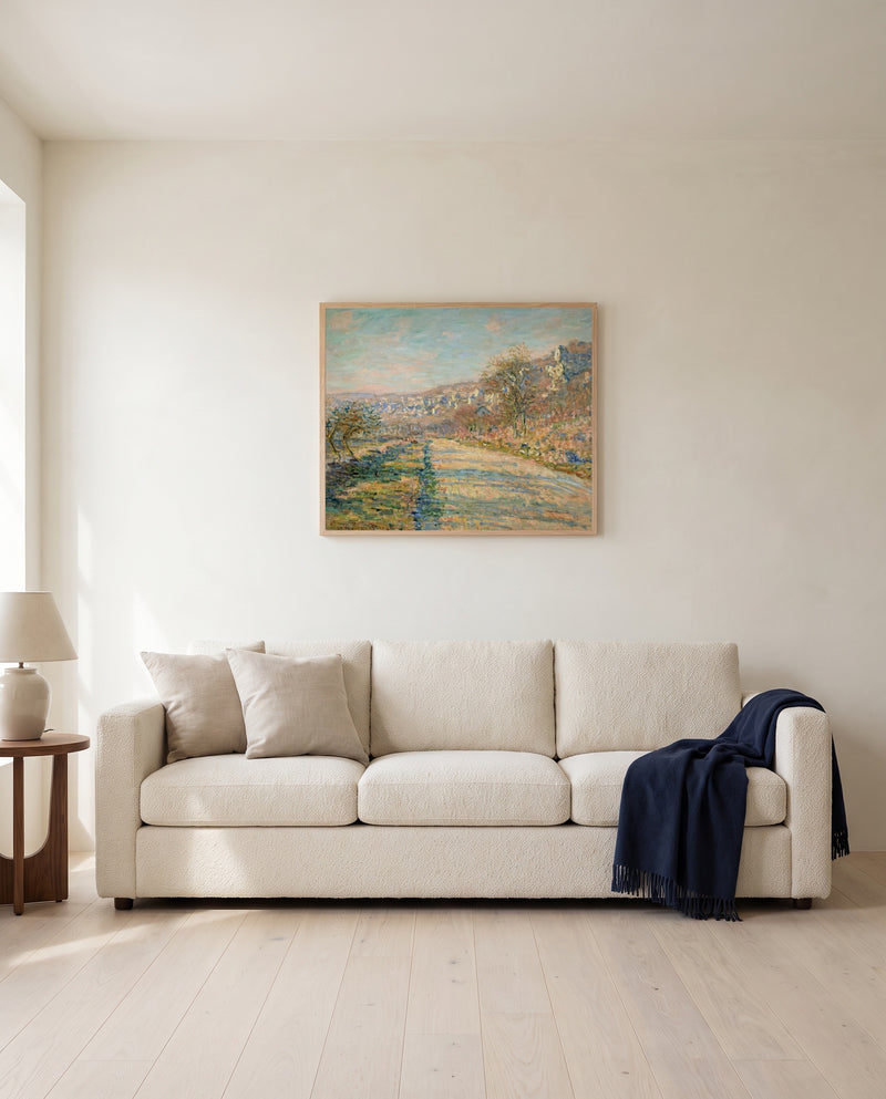 Road to La Roche-Guyon by Claude Monet framed in natural oak above a cream sofa in a warm living room